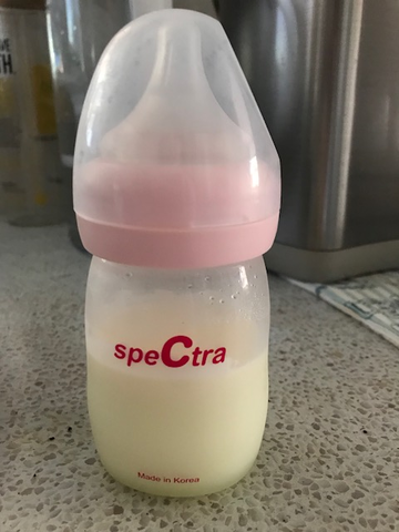 bottle of breast milk in Spectra bottle